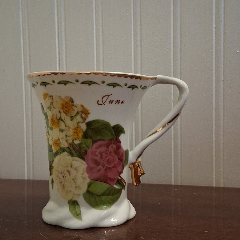 N.D Exclusive Elegant June.  Tea Cup Floral Design And Gold Trim.